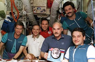 Group shot, Korzun holding plaque 